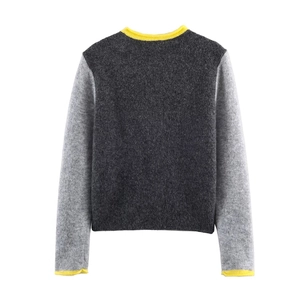 Women's crewneck knit cardigan in grey color block with vibrant yellow ribbed edges