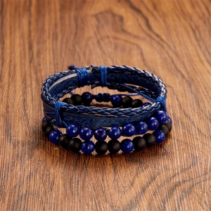 Detail of layered blue braided leather and natural stone beaded bracelet set for men