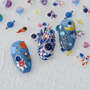 Stickers ongles 3D relief espace avec astronaute et fusée sur ongles bleus brillants
