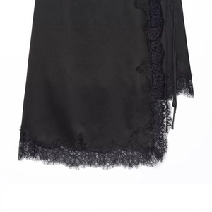 Elegant black satin dress with delicate lace trim on a clean white background