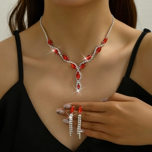 Elegant bridal jewelry set featuring red marquise cut stones and teardrop tassel earrings