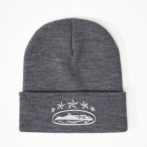 Dark grey knitted beanie featuring five white embroidered stars and landscape motif