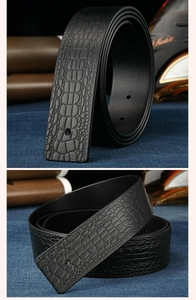 Detailed macro view of black crocodile pattern embossed leather belt without buckle strap