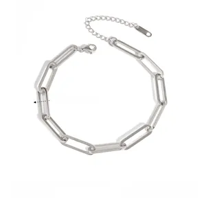 Detailed view of polished stainless steel paperclip chain bracelet with secure lobster clasp