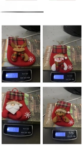 Weight measurement of 4 mini Christmas stockings featuring Santa, Snowman, Deer and Bear