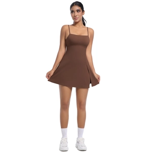 Side slit detail of a brown athletic tennis dress with slim straps and sleek fabric