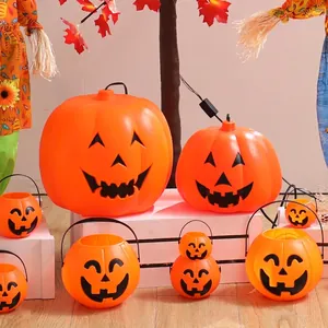 Extra large light up Halloween pumpkin lantern set with orange plastic buckets and maple leaves