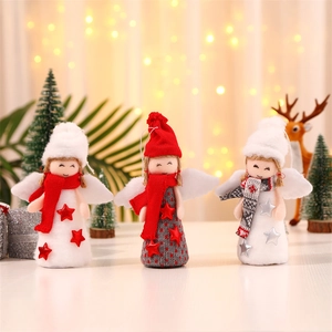 Detailed view of three plush Christmas angel ornaments with wings and knit hats for decor