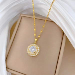Luxurious gold titanium necklace with sparkling round diamond pendant on jewelry box