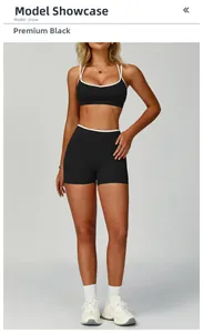 Set yoga nero premium con bordini a contrasto e reggiseno sportivo aperto