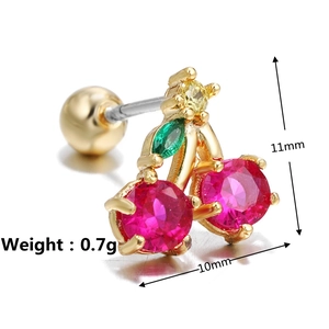 Macro shot of gold cherry stud earrings with size specs and screw back detail