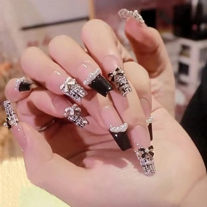 Handmade black tweed press-on nails with elegant pearl and bow accent decorations
