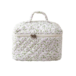 Floral quilted makeup bag with purple flower pattern and dual zipper top handle