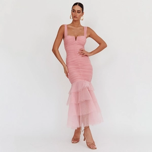Detail of pink bodycon dress featuring mesh fishtail hem and ruched textured design