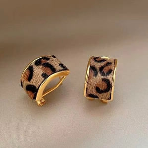 Leopard print faux fur C-shaped earrings with gold metal accents for a retro look