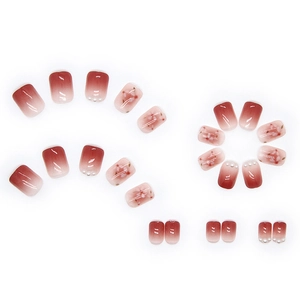 Pink pearl press-on nails with cherry blossom art and gradient glossy finish