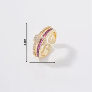 Detail view of gold butterfly ring showing 2.0cm height and purple gemstone setting