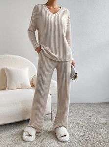 Detail showing high-quality ribbed knit texture and V-neck of the beige lounge set