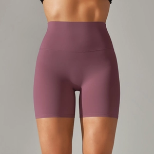 Close-up of high-waist yoga shorts in mauve with seamless knit and tummy control