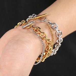 Detail of layered titanium steel O-chains with OT toggle clasp on wrist for men