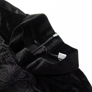 Elegant black velvet dress featuring a high collar with intricate floral lace detailing