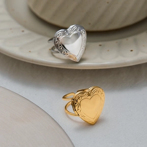 Vintage heart locket ring in gold and silver finish with elegant floral engraving