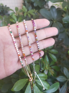 Rainbow cubic zirconia tennis bracelets in gold and silver plating with adjustable sliders