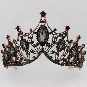 Detail of baroque black bridal crown featuring bronze alloy openwork and dark grey gems