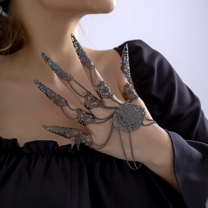 Gothic black metal claw ring bracelet with intricate hollow filigree details and chains