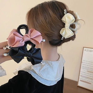 Elegant satin bow hair claw clip with rhinestones in pink, black, and beige colors