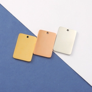 Close-up of rectangle mirror stainless steel blank tags in gold, rose gold and silver