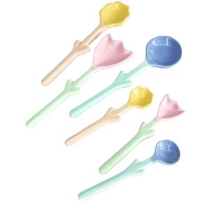 Set of 6 colorful floral ceramic spoons with long handles and tulip shapes on white backdrop