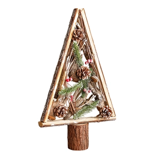 Handcrafted wooden Christmas tree ornament with pine cones and red berries on a steady base