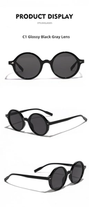 Detailed views of vintage oversized round sunglasses with shiny black frames and grey lenses