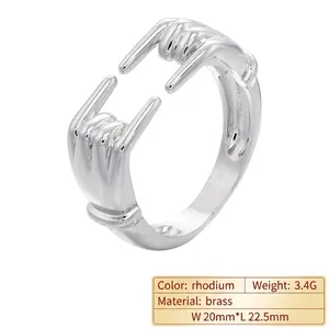 Polished rhodium plated brass open ring featuring a unique rock hand gesture design