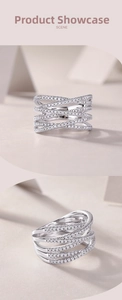 Macro detail of multilayer crisscross S925 silver ring with micro-pave moissanite stones