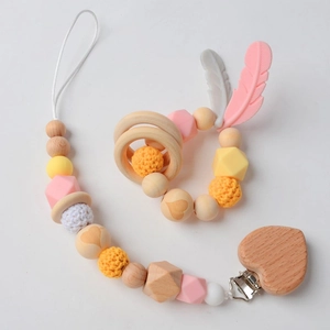Baby pacifier clip and wooden teether set with pink silicone beads and heart clip