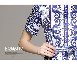 Detail of blue floral print dress featuring a mandarin collar and matching waist belt