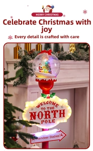 Close-up of LED Christmas North Pole sign with Santa globe and Reindeer Stables arrow