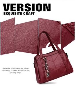 Detail of wine red tote bag with lychee texture, woven handle and cat tassel charm