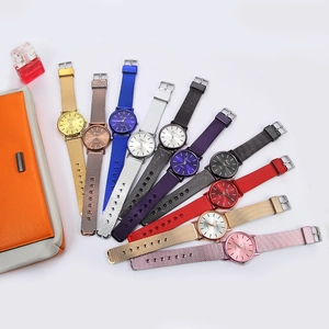 Collection of minimalist quartz watches with mesh straps in ten vibrant metallic colors