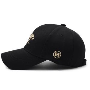 Black baseball cap with gold 'ATE' embroidery and side letter B in street style