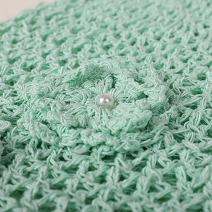 Handmade crochet cloche hat with mint green yarn flowers and pearl detail for women