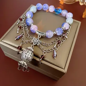 Flower bell crystal beaded layered bracelet with purple ice crackle beads and metal tassel