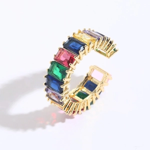 Detail of 14K gold plated ring featuring rainbow baguette-cut cubic zirconia gems