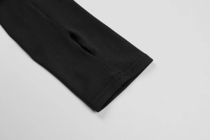 Detail of the black long sleeve cuff featuring a functional thumb hole and durable stitching