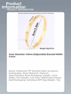 Detailed macro shot showing gold-plated stainless steel bangle with engraved star pattern