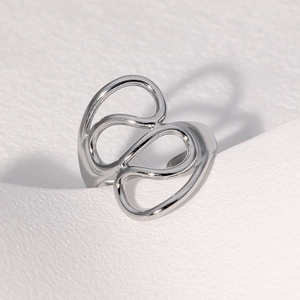 Detailed view of an abstract hollow line silver ring made of polished stainless steel