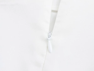 Detailed close-up of a high-quality white invisible zipper on the elegant floral skirt set