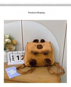 Close-up of soft plush Capybara backpack featuring delicate embroidery and metal chain